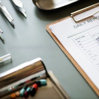 clipboard and pens on a table